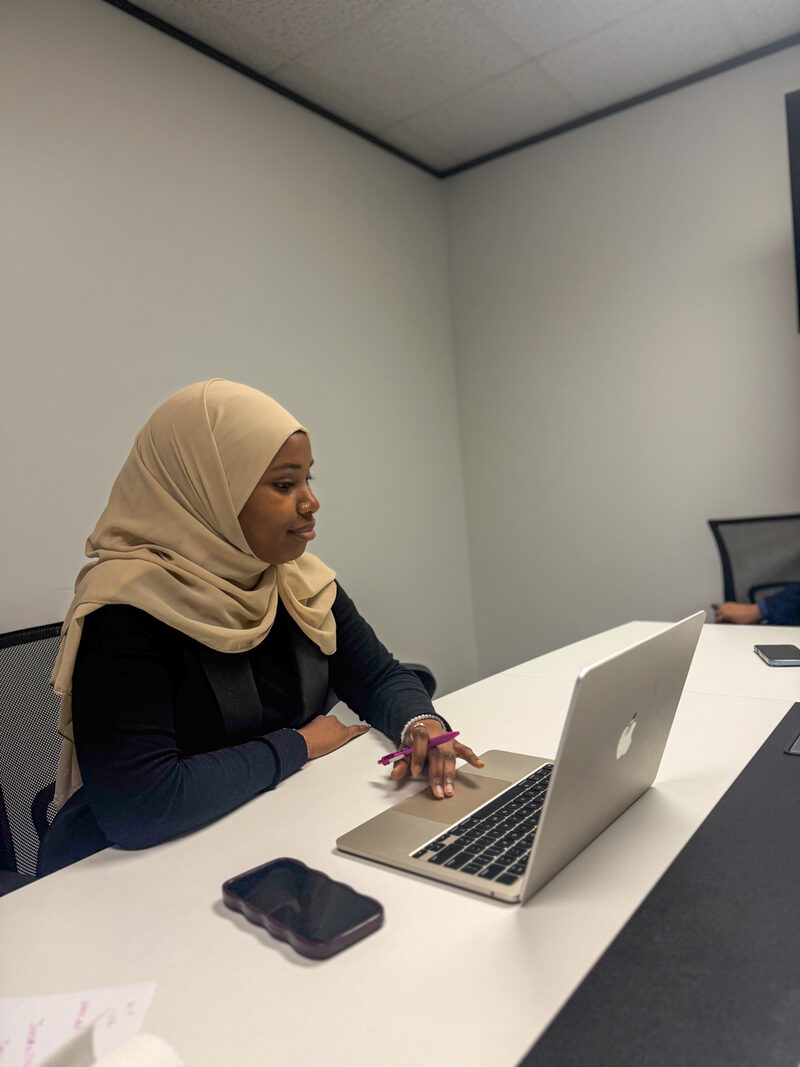 An Arsi Global Inc. account manager working on customer accounts