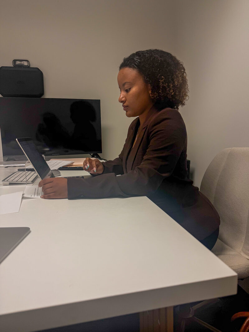 An Arsi Global Inc. team member planning a client campaign at a desk