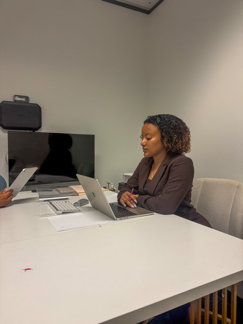 Team members reviewing marketing campaign materials at a desk